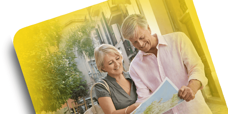 woman and man looking at a map and smiling